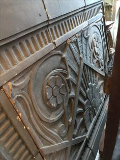 an intricately designed fireplace screen in the process of being worked on