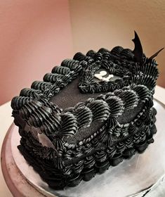 a black and white cake on top of a table