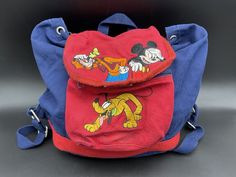 The Disney Store Mickey Mouse Backpack Flap Draw String Sack Bag Goofy Pluto Disney Mickey Mouse Backpack For Travel, Mickey Mouse Backpack For Travel, Mickey Mouse Everyday Backpack, Disney Mickey Mouse Bag For Back To School, Mickey Mouse Standard Backpack For Disney Trips, Mickey Mouse Standard Backpack, Casual Mickey Mouse Backpack For Back To School, Mickey Mouse Themed Backpack For Disney Trips, Mickey Mouse Themed Standard Backpack For Travel