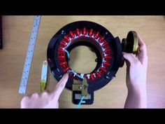 someone is working on an electronic device that looks like a clock with red and blue lights