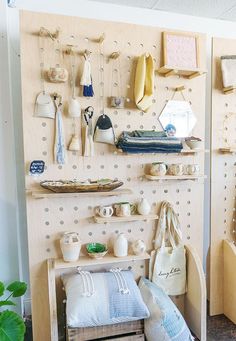 there are many items hanging on the wall in this room, including baskets and other things