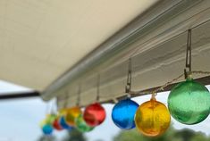 multicolored glass ornaments hang from the awning