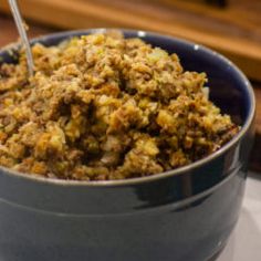 a bowl filled with food sitting on top of a table