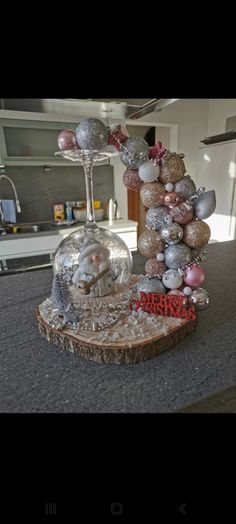 a christmas tree made out of ornaments on top of a counter