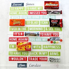 candy bar wrappers are arranged on top of a white board that says, happy to have my home again i missed you