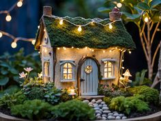 a small house with lights on the roof and trees in the back ground, surrounded by greenery