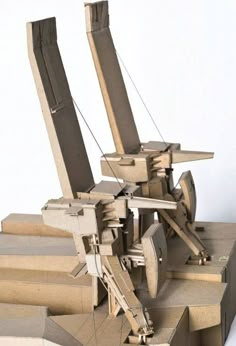 a sculpture made out of cardboard sitting on top of steps