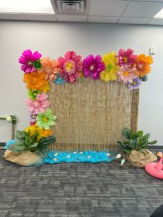 an office decorated with flowers and rafters on the floor in front of a bulletin board