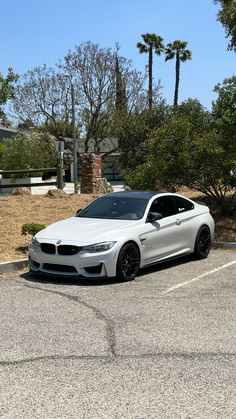 a white car parked in a parking lot