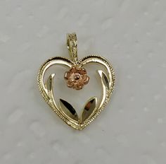 Solid 14k gold pendant. Diamond Cut finish for a radiant shine. Question? Please don't hesitate to contact me. *Wholesale or Custom* Wholesale: The more you buy, cheaper goes the price. Custom: Unique pieces to fit your very own style. (Different Color Gold) Contact Me for more information. Heart Pendant Jewelry With Flower Charm For Anniversary, Anniversary Jewelry Heart Pendant With Flower Charm, Anniversary Heart Pendant Jewelry With Flower Charm, Heart-shaped Flower Charm Jewelry For Anniversary, Gold Flower Shaped Jewelry For Valentine's Day, Gold Flower-shaped Jewelry For Valentine's Day, Rose Gold Heart Pendant Jewelry With Flower Charm, Gold Jewelry With Flower Charm For Valentine's Day, Valentine's Day Yellow Gold Jewelry With Flower Pendant