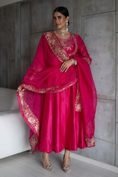 Hot pink silk chanderi anarkali with zari and gota hand embroidery. Comes with straight pant, an organza dupatta and a potli.
Components: 4
Pattern: Embroidered
Type Of Work: Zari, Gota
Neckline: Round
Sleeve Type: Full
Fabric: Silk chanderi, Dupatta: Organza
Color: Pink
Other Details: 
Note: Jewellery worn by the model is not for sale.
Occasion: Sangeet - Aza Fashions Silk Suit Designs Indian, Pink Indian Suit, Pink Suits Women, Silk Anarkali Suits, Anarkali Dress Pattern, Pink City, Indian Dresses Traditional, Boutique Dress Designs, Party Wear Indian Dresses