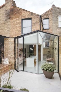 an extension to a house with glass walls