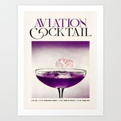 an advertisement for a cocktail with a purple drink in the glass and garnish