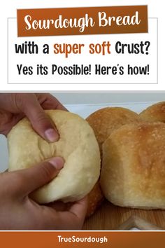 someone is holding a bread roll in their hand with the words, sourdough bread with a super soft crust? yes it's possible here's how