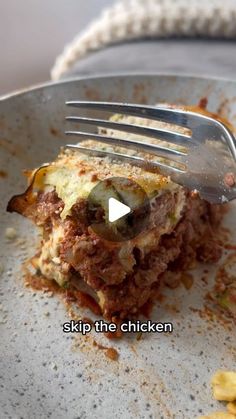 a fork is stuck into some food on a plate