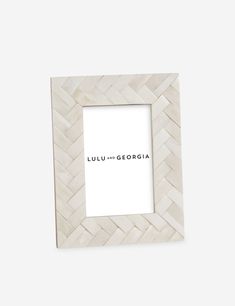 a white photo frame with the words lulu and gedroia written on it