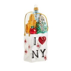 a glass ornament with the words i love new york in it's pouch