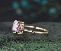 - Metal: Solid gold(10K/14K/18K white/yellow/rose gold),925 sterling silver,platinum available.- Main Stone: 6x8mm Oval cut lab opal- Accent Stone: Purple amethyst and moissanites or diamonds(G-H,Clarity SI-VS)- Band Width: 1.4mm- Can be personalized: Yes White Opal Engagement Ring, Topaz Birthstone, Wedding Anniversary Ring, Opal Engagement Ring, Opal Engagement, Wedding Anniversary Rings, Engagement Rings Opal, Crystal Wedding, Unique Gemstones