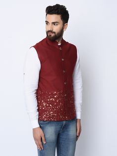 With a splash of gold foil and button detailing, this maroon bandhgala is a stunner.
Style Tip : A classic combination of maroon and black can never go wrong. Team this jacket with a plain black kurta pajama set.