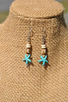 Just in time for summer, you can pick up these little beach theme earrings! I used turquoise color howlite starfish beads, bone beads and small wood beads to create the design. The eye pins and ear wires are stainless steel, making them easy to wear and care for. Need a gift idea for some one who loves the beach and tropical settings or want to add something new to your own accessory collection? Then check out these unique handmade earrings! Length from top of ear wire - appx 2.05 inches Thank you for shopping with small business! If you love these handmade starfish earrings, then check out our other creations from our home page: www.etsy.com/shops/Rocks2Gems2Wire or have something custom made just for you! PLEASE read our policy and jewelry care information below before ordering and Thank Bohemian Starfish Jewelry For Vacation, Starfish-shaped Beaded Beach Jewelry, Handmade Bohemian Starfish Jewelry, Handmade Coastal Jewelry For Summer, Bohemian Starfish Charm Jewelry For Crafting, Bohemian Starfish Charm Jewelry For Jewelry Making, Bohemian Jewelry With Starfish Charm For Jewelry Making, Handmade Turquoise Jewelry For Beach Season, Handmade Beachy Jewelry For Beach Season