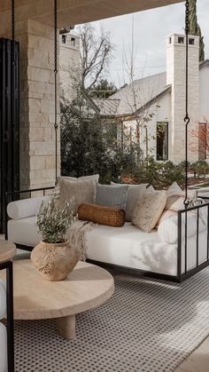 a white couch sitting on top of a wooden table