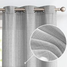 an image of a curtain with the fabric pulled back to show it's texture