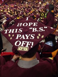 a graduation cap that says i hope this b s pays off with money on it