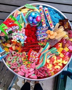 a large bowl filled with lots of candy and candies