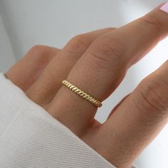 Beautiful and dainty ring, featuring a textured design.  It's minimalist design makes it super versatile. Can be paired with rings you already own, or looks great on its own! - - - D E T A I L - - -  * Made of 925 Sterling Silver * We use a THICK, DURABLE plating of 14k Gold or Rhodium * Available in sizes 6-9 * Nickel-free & Hypoallergenic  * Width measures 2.5mm Opal Baguette Ring https://www.etsy.com/listing/1207691956/opal-ring-baguette-ring-dainty-opal-ring?click_key=2bd59d472302371731921a9e740d60b37b6f5bcb%3A1207691956&click_sum=63f12c2c&ref=shop_home_active_8 Spiral Ring https://www.etsy.com/listing/1221623511/dainty-ring-minimalist-ring-stacking?click_key=9ae4aced143fc2358685845fd4909ac95675723c%3A1221623511&click_sum=c8527cd2&ref=shop_home_active_1 Diamond Eternity Ring https://ww Rope Rings, Stackable Jewelry, Pear Ring, Spiral Ring, Zierlicher Ring, Teardrop Ring, Etsy Gold Ring, Textured Ring, Ring Stacking