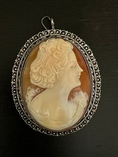 A very beautiful 1930 silver filigree shell cameo pendant brooch . 5.5x4.5cm Luxury Cameo Brooches, Formal Cameo Brooch, Elegant Black Cameo Brooches, Classic Cameo Collectible Brooches, Oval Silver Cameo Brooch, Collectible Cameo Pendant Brooches, Pendant Brooch, Cameo Pendant, Silver Filigree