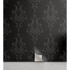 black and silver wallpaper with an ornate design