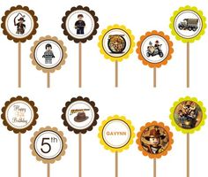 an assortment of birthday cupcake toppers on sticks