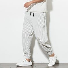 Fabric:Linen / Cotton Blend,Linen; Gender:Men's; Style:Chinoiserie; Elasticity:Micro-elastic; Occasion:Home,Daily; Details:Only pants; Fit Type:Slim; Function:Comfort,Breathable; Waistline:Mid Waist; Pattern:Striped; Design:Drawstring,Stripe; Special Size:Normal; Pants Type:Sweatpants; Fly Type:Elasticity,Drawstring; Front page:FF; Listing Date:09/15/2020; Production mode:Self-produce; Hips:; Length:; Waist:; Pattern Theme:White,Black; Special selected products:COD; Pants Length:Ankle-Length; Pr Striped Harem Pants, Navy Pants Men, Theme White, Korean Jeans, Harem Pants Men, Mens Linen Pants, Pants Male, Striped Sweatpants, Trousers Men