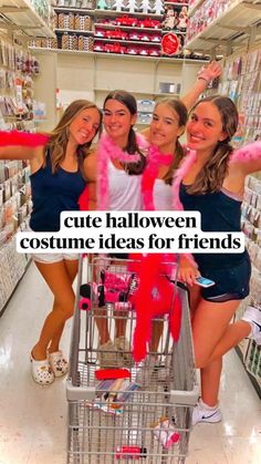 three girls are posing for the camera in a shopping cart with pink pom poms