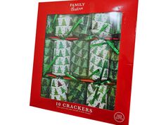 a red box filled with crackers covered in green and white frosted christmas trees