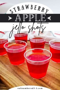 strawberry apple jello shots on a cutting board with text overlay that reads, strawberry apple jello shots