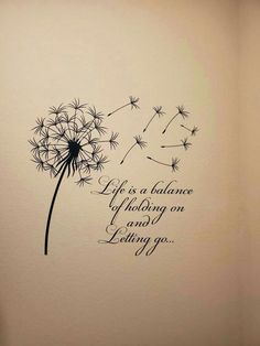 a dandelion wall decal with the words life is balance and letting go