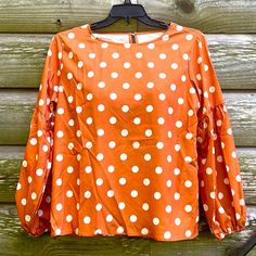 Adorable Mustard/Gold Color Polka Dot Blouse That Has Never Been Worn. It Was Only Taken Out Of The Packaging To Be Tried On. It Is Very Stylish With A Round Neck And Back Button Enclosure. The Balloon Sleeves Are Very Flattering And Have Elastic At The Wrist. Made Of 95% Polyester And 5% Spandex. Measurements Are: Pit To Pit - 22”, Shoulder To Hem - 26.5”, Sleeve Seam To Wrist - 24”. Of Course No Rips Or Stains And Comes From A Smoke Free Home. Casual Polka Dot Blouse For Fall, Cute Polka Dot Top For Spring, Cute Spring Polka Dot Tops, Polka Dot Long Sleeve Blouse For Brunch, Long Sleeve Polka-dot Blouse For Brunch, Long Sleeve Polka Dot Blouse For Brunch, Polka Dot Blouse, The Balloon, Balloon Sleeves