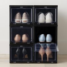 six pairs of shoes are stacked on top of each other in clear plastic bins