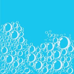 water bubbles floating in the air against a blue background