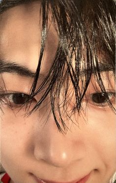 a close up of a person with wet hair