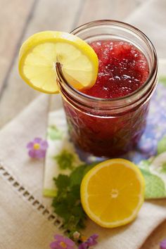 a mason jar filled with raspberry lemonade