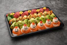 an assortment of sushi with smiling faces on them