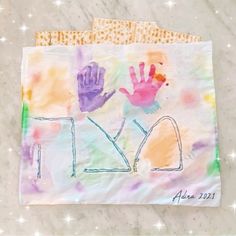 two handprints on a piece of paper with the word joy written in it