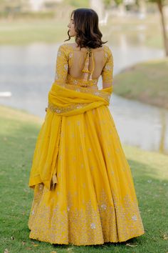 Mustard lehenga with dori and zardozi embellished floral motifs. Paired with blouse and dupatta.
Components:3
Pattern:Embellished
Type of Work:Dori, zardozi, floral
Neckline:Sweetheart
Sleeve Length:Half
Fabric:Bamberg silk, organza
Color:Yellow
Other Details:
Side and back tassel tie-up
Cutwork bordered sheer dupatta
Occasion:Bride - Aza Fashions Dola Silk Choli With Chandbali Shape For Wedding, Dola Silk Chandbali Choli For Wedding, Wedding Dola Silk Dresses With Cutdana, Wedding Lehenga In Cutdana Raw Silk, Anarkali Choli With Cutdana For Wedding, Wedding Anarkali Choli With Cutdana, Yellow Wedding Gown With Intricate Embroidery, Yellow Dola Silk Lehenga For Wedding, Wedding Lehenga In Art Silk With Cutdana