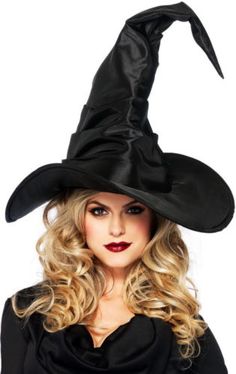 a woman wearing a witches hat with long blonde hair