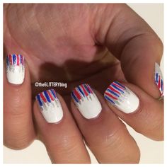 a person with red, white and blue manies on their nails