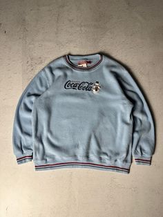 Vintage Coca~Cola Fleece Sweatshirt - Women's Medium Size On Label: Youth's Large Recommended Size: Women's Medium Measurements: Pit-to-Pit: 24" Length: 27" Long Sleeve Fleece Top With Embroidered Graphics, Blue Fleece Tops With Graphic Print, Blue Graphic Print Fleece Tops, Blue Fleece Top With Graphic Print, Retro Tops With Embroidered Graphics For Winter, Winter Sports Tops With Embroidered Graphics, Winter Sports Top With Embroidered Graphics, Graphic Print Fleece Crew Neck Top, Fleece Crew Tops With Embroidered Graphics