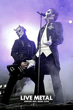 two men in costumes on stage with microphones