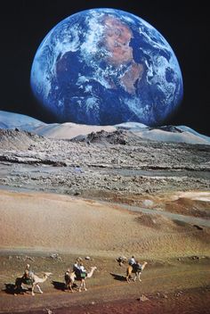 three people riding camels in front of the earth on top of a desert area